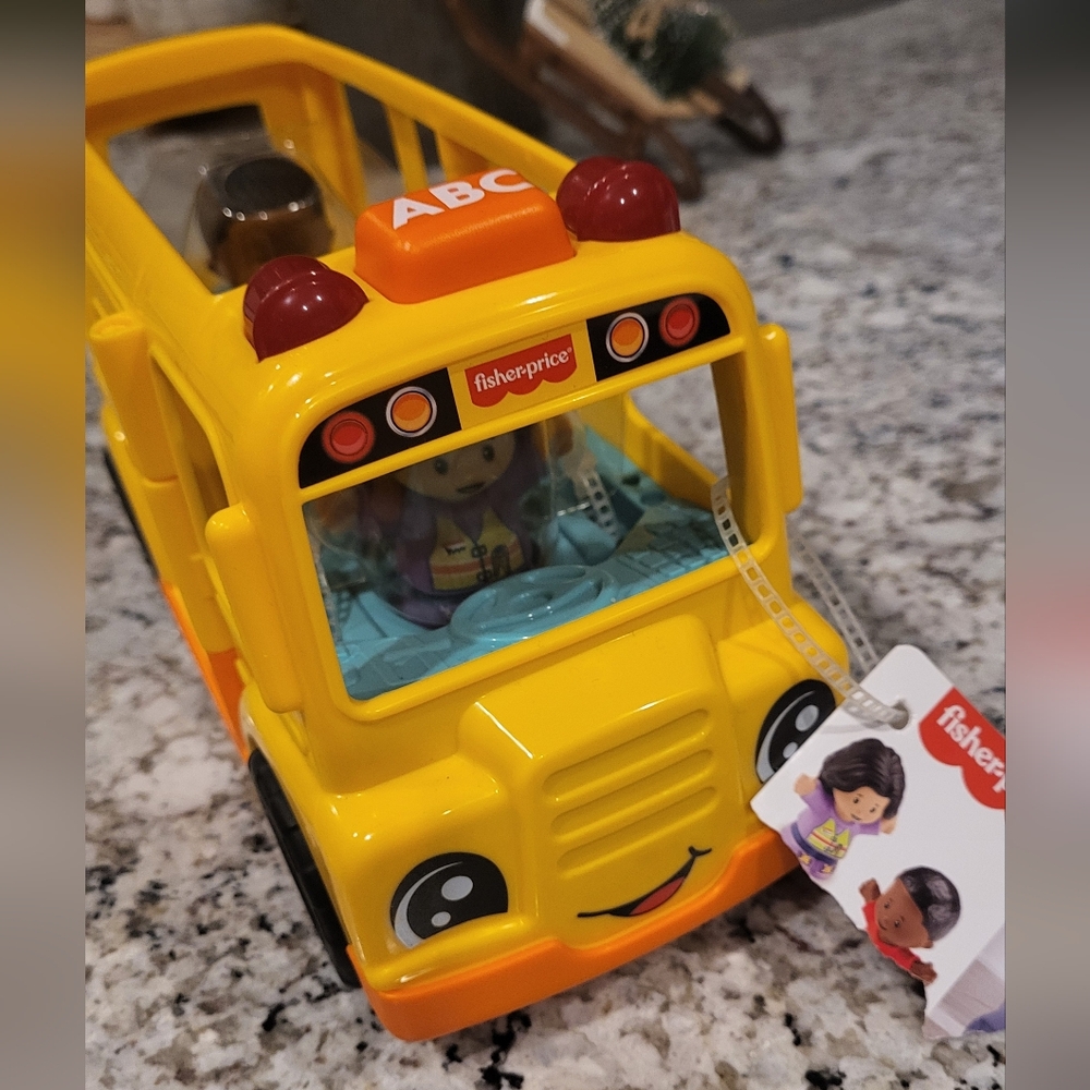 NWT Fisher-Price Musical Yellow School Bus Toy